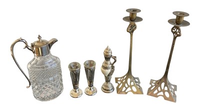 Lot 1240 - A pair of Art Nouveau brass candlesticks,...