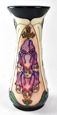 Lot 144 - MOORCROFT; a vase in the 'Foxglove' design,...