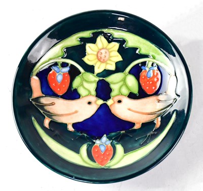 Lot 173 - MOORCROFT; a circular dish in the 'Strawberry...