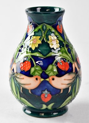 Lot 129 - MOORCROFT; a vase in the 'Strawberry Thief'...