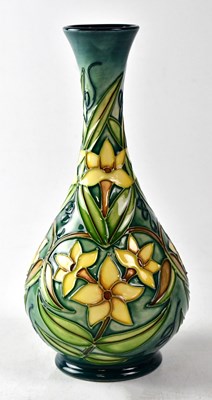 Lot 140 - MOORCROFT; a vase in the 'Jasmine' design,...