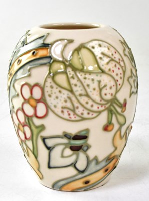 Lot 125 - MOORCROFT; a small vase in the 'Golden Lily...