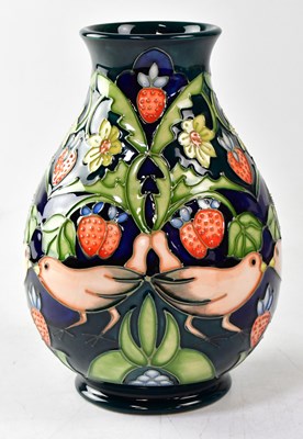 Lot 137 - MOORCROFT; a vase in the 'Strawberry Thief'...