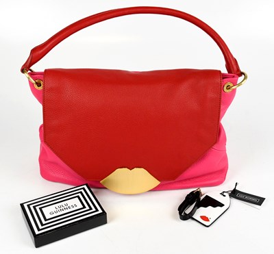 Lot 687 - LULU GUINNESS; a red and pink pebbled leather...