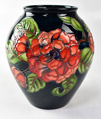 Lot 153 - MOORCROFT; a vase in the 'Camelia' design,...