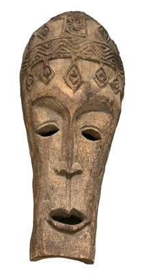 Lot 1218 - A large African carved mask, height 110cm,...