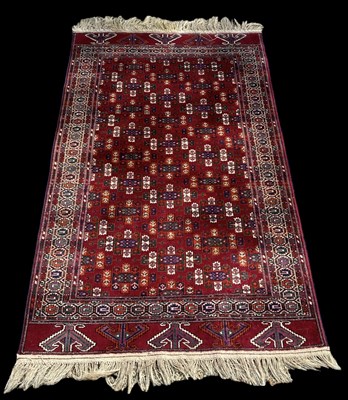 Lot 95 - A modern red ground Persian style carpet with...