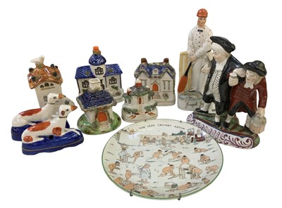 Lot 585 - A group of eight Staffordshire figures...