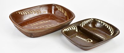 Lot 1387 - Two slipware serving dishes, the larger length...