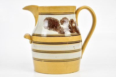 Lot 1394 - A 19th century Mocha ware jug, decorated with...