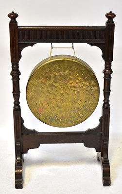 Lot 44 - An early 20th century oak dinner gong, with...