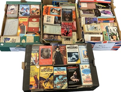 Lot 386 - Four boxes of paperback books, with some first...