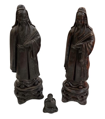 Lot 1044 - A pair of Chinese carved hardwood figures of...