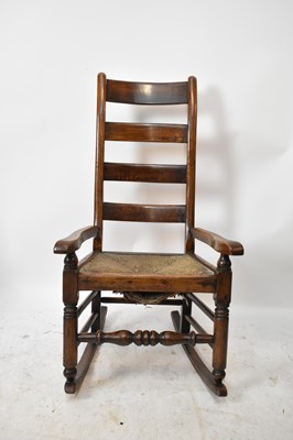 Lot 1483 - An 18th century rush seated ladder back...