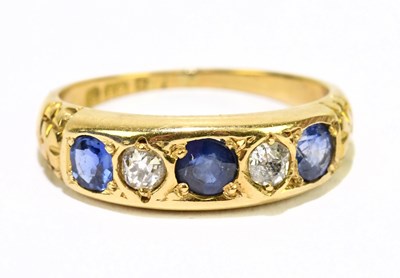 Lot 1106 - An 18ct yellow gold sapphire and diamond five...