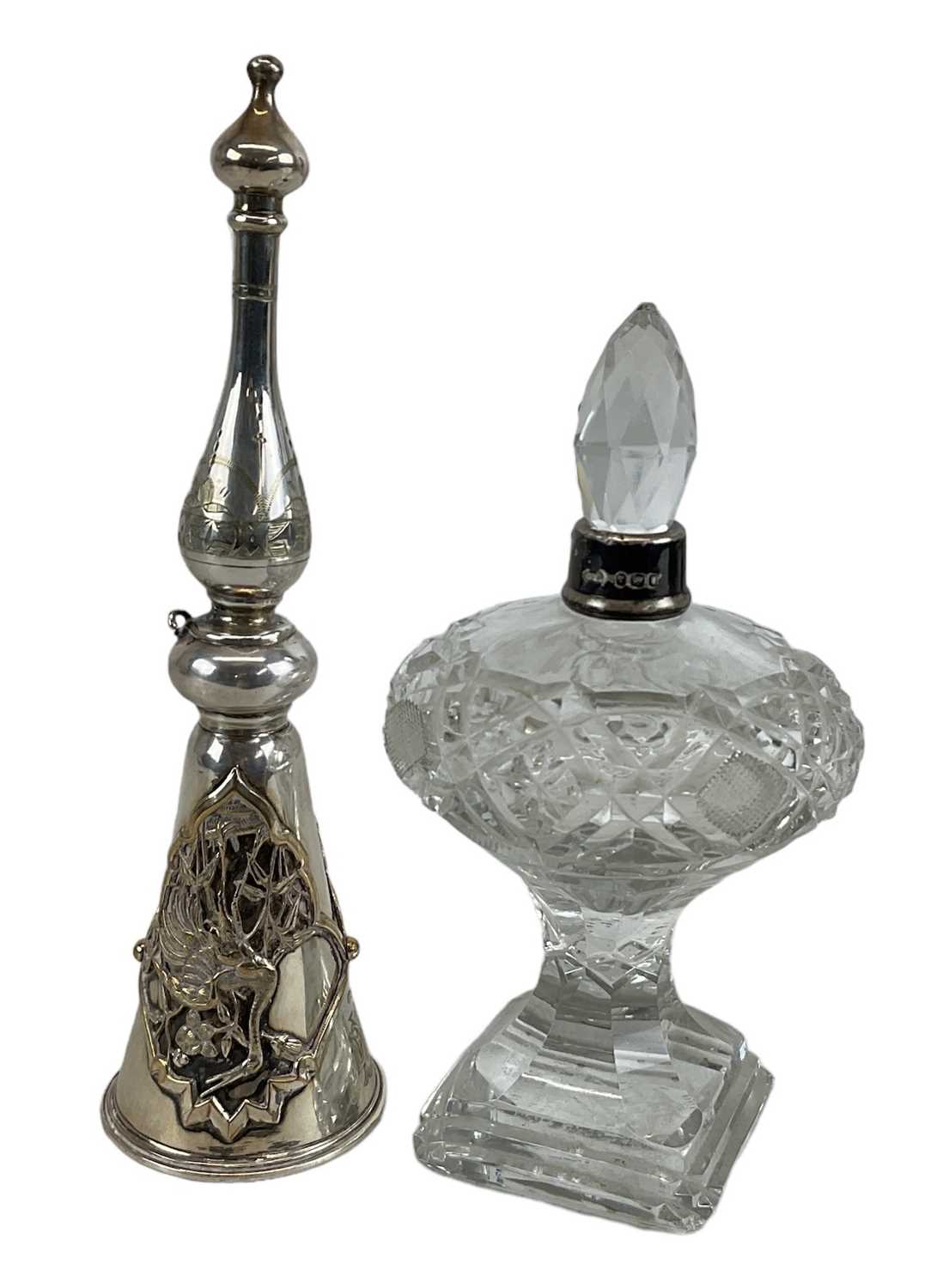 Lot 1341 - A white metal candle snuffer, with decoration...