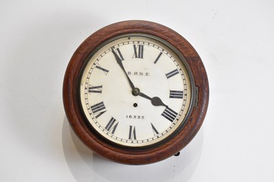 Lot 335 - An early 20th century oak cased wall clock...