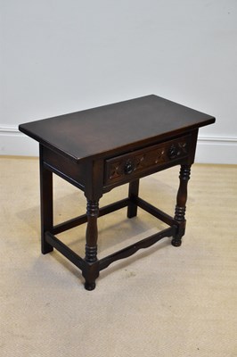 Lot 274 - A modern oak side table with single drawer on...