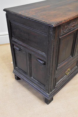 Lot 8 - A late 17th century carved oak mule chest with...