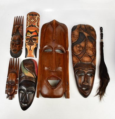 Lot 1332 - A collection of six decorative African masks,...