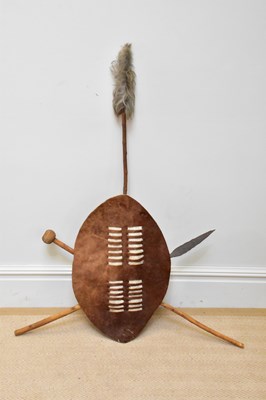 Lot 1334 - A 20th century Zulu shield, spear and knobkerrie.