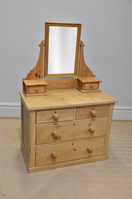 Lot 20 - An old stripped pine mirror back dressing...