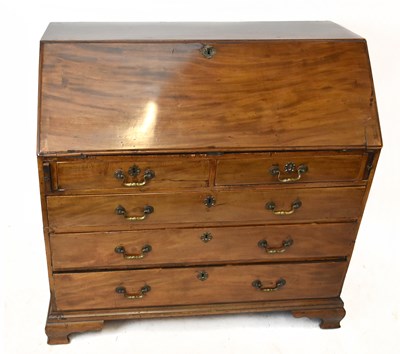 Lot 2970 - A Georgian mahogany bureau, the fall front...