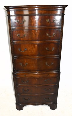 Lot 3045 - A 1950s mahogany serpentine fronted chest on...