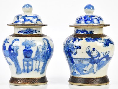 Lot 1249 - A pair of Chinese blue and white crackle...