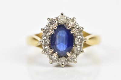 Lot 62 - An 18ct yellow gold diamond and sapphire set...