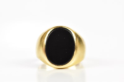 Lot 115 - A yellow metal gentleman's signet ring, with...