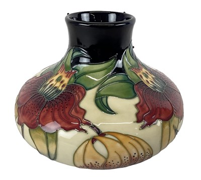 Lot 555 - MOORCROFT; a 'Anna Lily' pattern vase, marks...