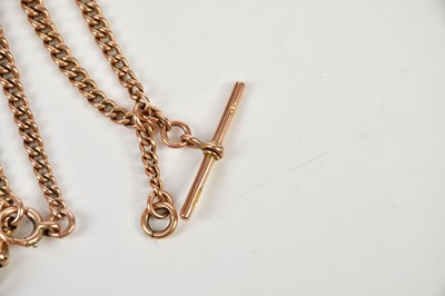 Lot 2326 - A 9ct rose gold Albert chain with T-bar, each...