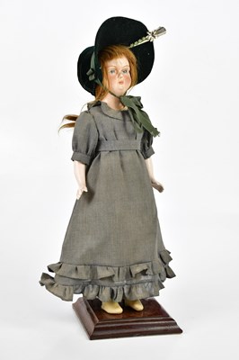 Lot 95 - A 20th century provincial composition doll,...