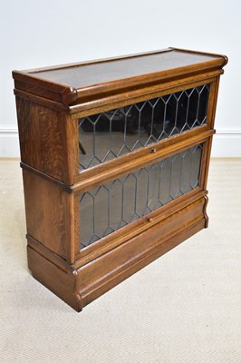 Lot 197 - GLOBE WERNICKE; an oak two tier metal bound...