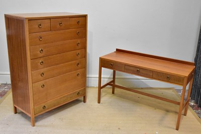 Lot 1017 - A 1960s teak bedroom chest and dressing table,...