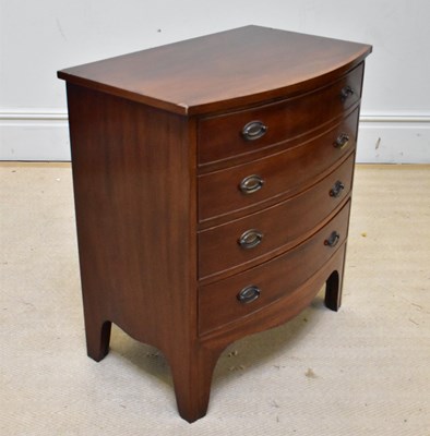 Lot 1082 - A reproduction mahogany bowfront chest, with...