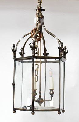 Lot 105 - A contemporary bronzed hexagonal hall lantern...