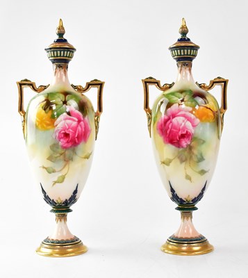 Lot 192 - ROYAL WORCESTER; a pair of twin-handled lidded...