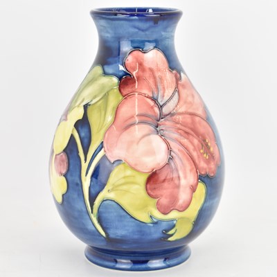 Lot 126 - WALTER MOORCROFT; a blue ground 'Hibiscus'...