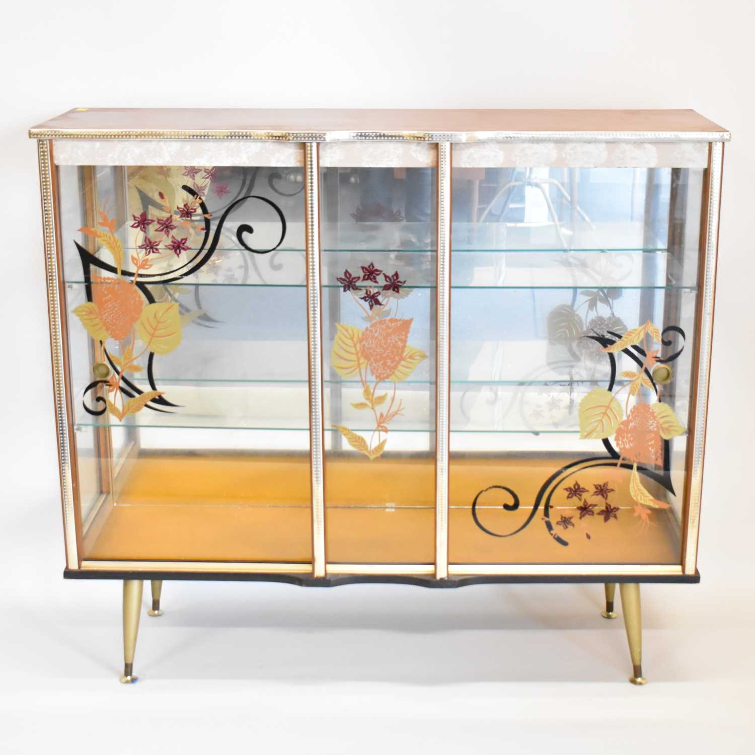 Lot 5 - A 1960s glass cocktail/display cabinet, with...