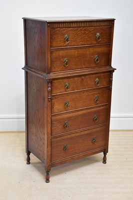 Lot 37 - An early 20th century oak six drawer chest, on...