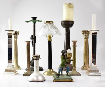Lot 90 - A collection of various candlesticks to...