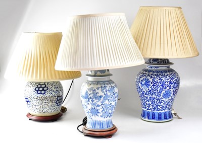 Lot 91 - Three Chinese blue and white table lamps in...