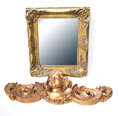 Lot 78 - A gilt-framed wall mirror with bevel edged...