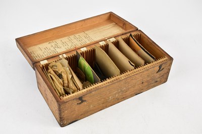 Lot 1040 - A pine box containing various violin parts,...