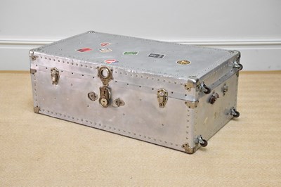 Lot 599 - A silvered metal trunk with studded detail and...