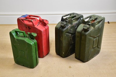 Lot 609 - Four vintage metal jerry cans including a red...