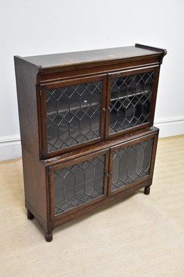 Lot 196 - MINTY; a two tier bookcase with leaded glazed...