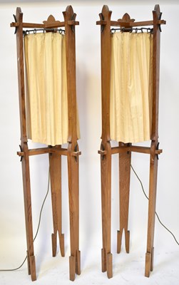 Lot 107 - A pair of oak Arts and Crafts style standard...